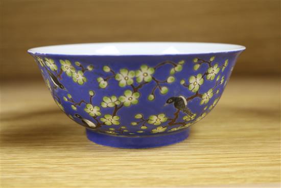 A Chinese blue ground prunus and blackbird bowl, bearing Qianlong mark to the base, diameter 14cm